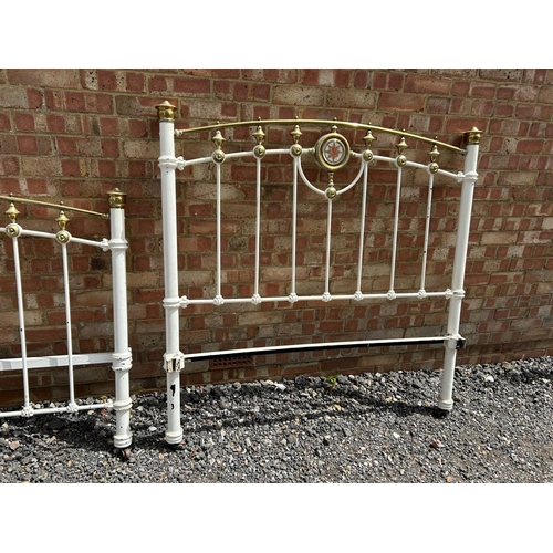 26 - A Victorian iron and brass double bed frame