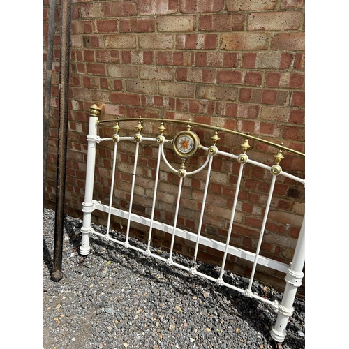 26 - A Victorian iron and brass double bed frame