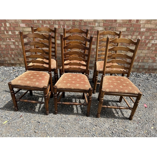 28 - A set of six reproduction oak ladder back dining chairs by  BRIGHTS OF NETTLEBED