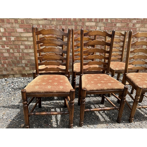 28 - A set of six reproduction oak ladder back dining chairs by  BRIGHTS OF NETTLEBED