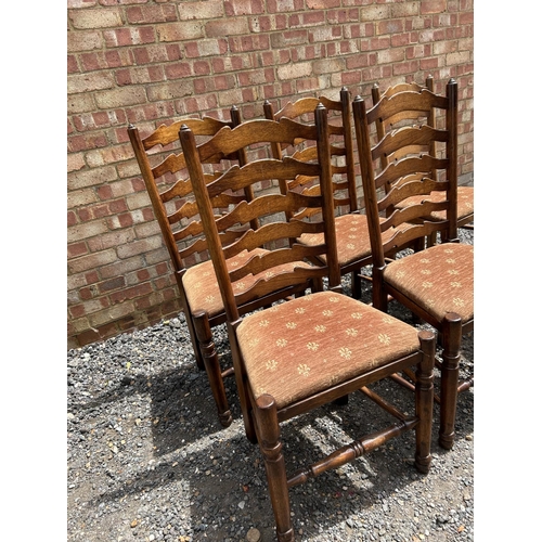 28 - A set of six reproduction oak ladder back dining chairs by  BRIGHTS OF NETTLEBED