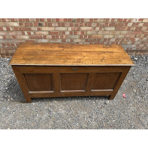 32 - An antique oak three panel blanket box 140x50x72