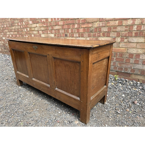 32 - An antique oak three panel blanket box 140x50x72