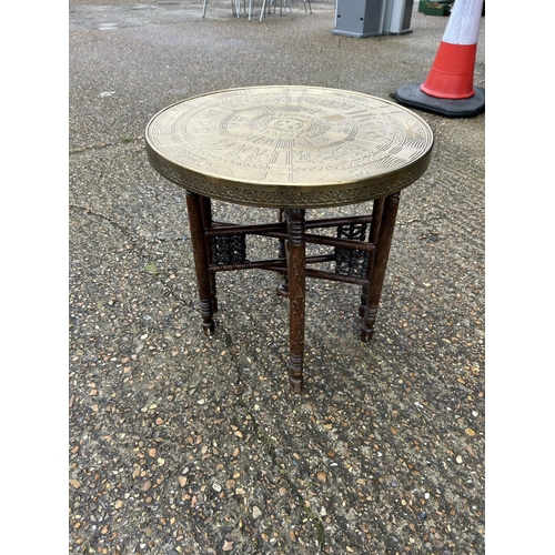 353 - A brass top table with folding base