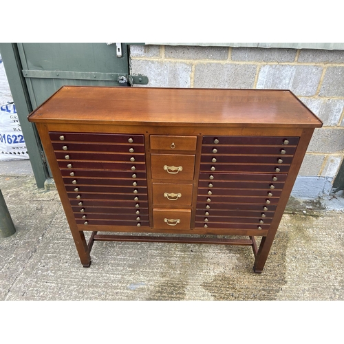 36 - A modern hardwood chest of 10 drawers 123x42x110