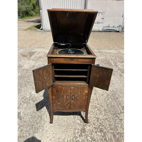 360 - An oak cased cabinet gramophone