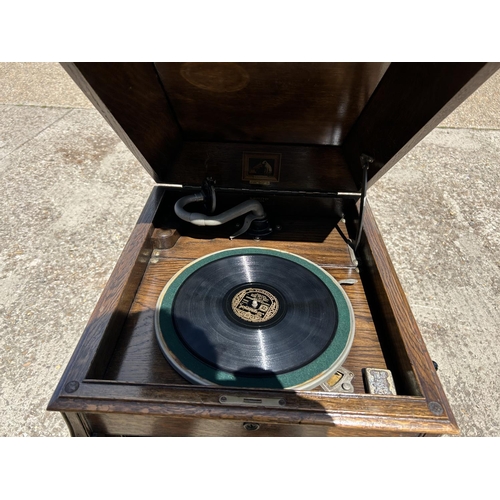 360 - An oak cased cabinet gramophone