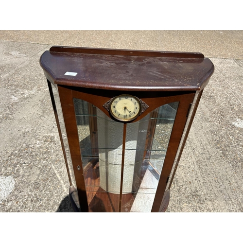 361 - A deco style cabinet with clock