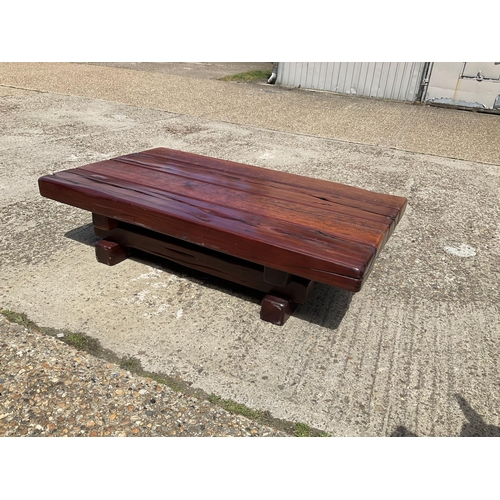 366 - A very large thick hardwood coffee table crafted from railway sleepers 155x90x 45