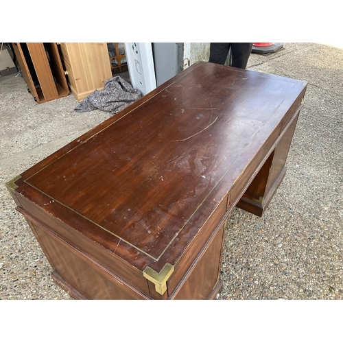 367 - A reproduction mahogany military style desk with brass inlaid top 153x77x77