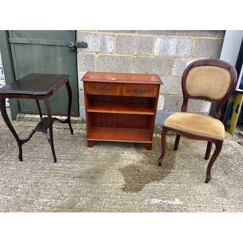 43 - Repro yew two drawer bookcase together with mahogany occasional table and a chair