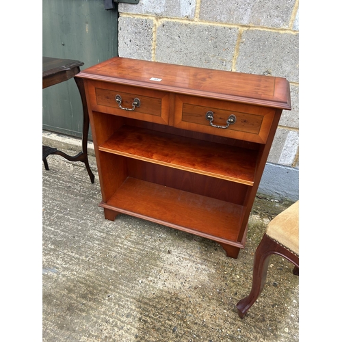 43 - Repro yew two drawer bookcase together with mahogany occasional table and a chair