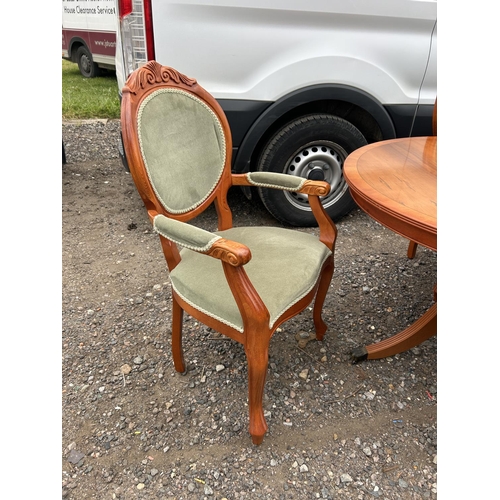 45 - A reproduction yew wood twin pedestal dining table with extension leaf and set of six matching chair... 