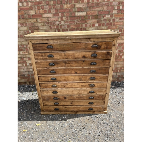 62 - A large pine architects plan chest of 10 drawers with cup handles 127x53x145