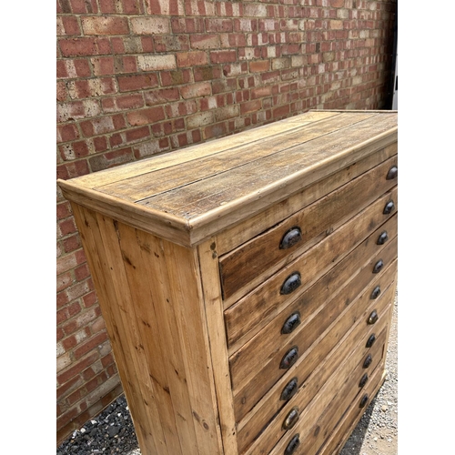 62 - A large pine architects plan chest of 10 drawers with cup handles 127x53x145