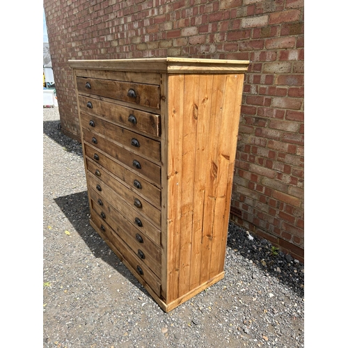 62 - A large pine architects plan chest of 10 drawers with cup handles 127x53x145