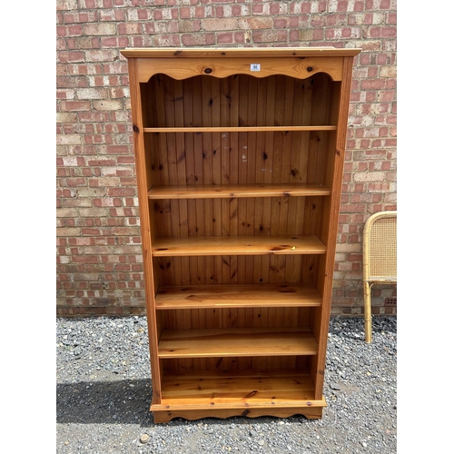 66 - A pine opem fronted bookcase 91x30x185