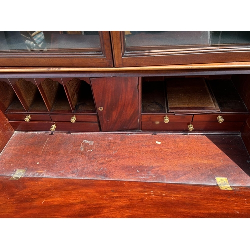 71 - A Victorian mahogany bureau bookcase fitted to the interior 122x50x210