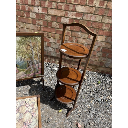 77 - A folding cake stand, a tapestry fire screen and an oak footstool