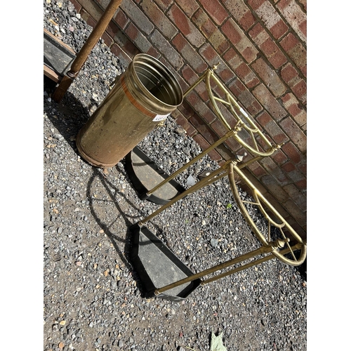 79 - An oak hallstand together with four brass stick stands