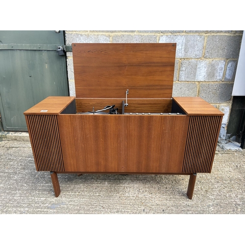 83 - A teak cased radiogram 120x 42 x66