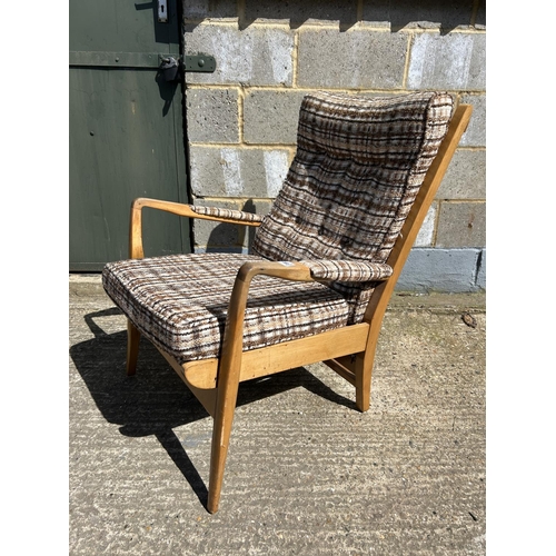 86 - A retro teak framed armchair