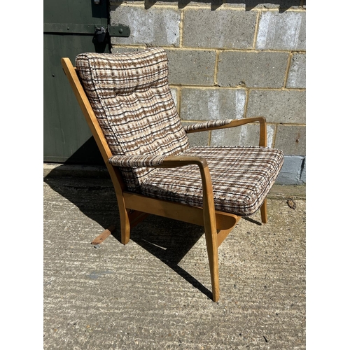 86 - A retro teak framed armchair