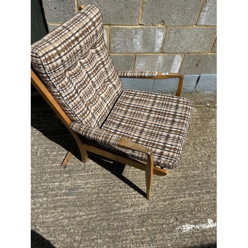 86 - A retro teak framed armchair