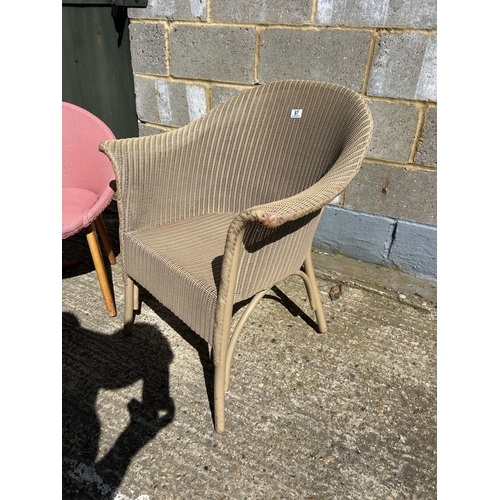 87 - A gold Lloyd loom chair together with a retro pink bedroom chair