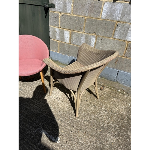 87 - A gold Lloyd loom chair together with a retro pink bedroom chair