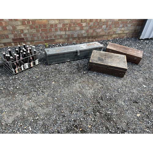 9 - A large tin trunk, two wooden tool boxes and a vintage beer crate with bottles