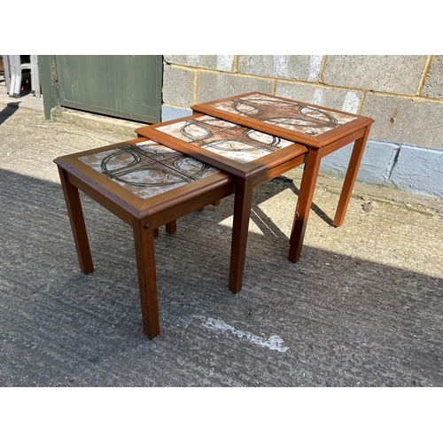 98 - A danish teak tile top nest of three tables marked TRIOH