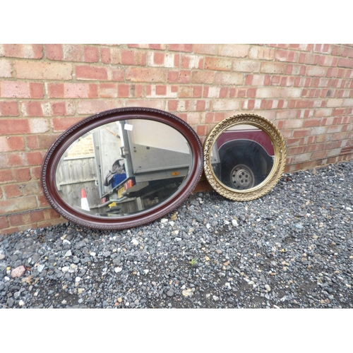 10 - Two large oval wall hanging mirrors