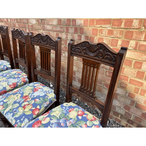 100e - A set of four Edwardian dining chairs with blue floral upholstered seats