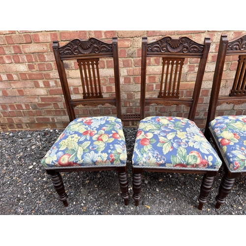 100e - A set of four Edwardian dining chairs with blue floral upholstered seats