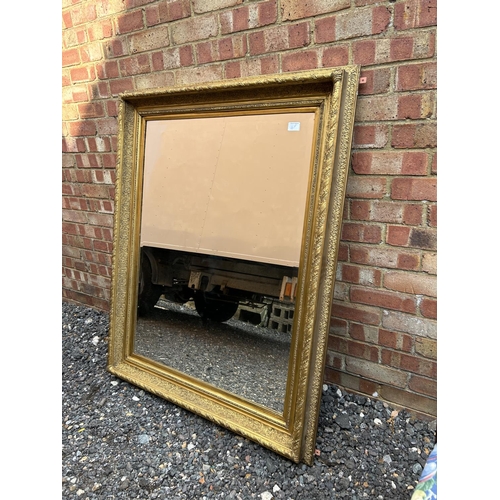 100f - A very large heavy gold gilt framed mirror 100x125