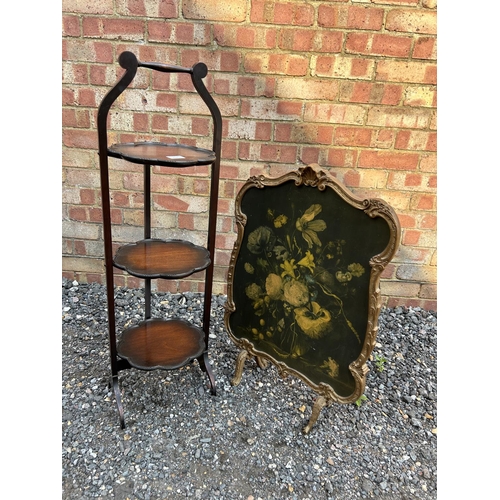 100j - Ornate folding cake stand and a gilt framed fire screen