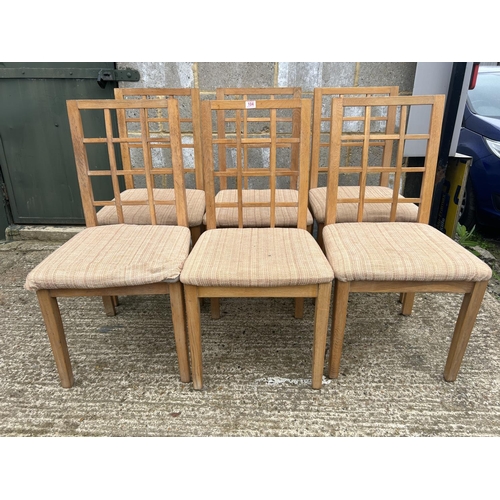 104 - A set of six lattice back dining  chairs purchased from HEALS