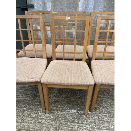 104 - A set of six lattice back dining  chairs purchased from HEALS