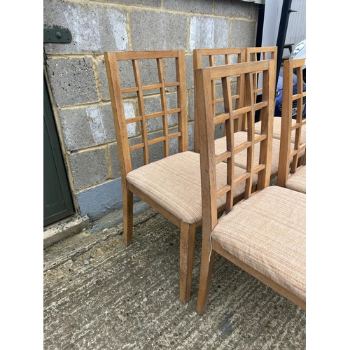 104 - A set of six lattice back dining  chairs purchased from HEALS