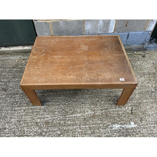 105 - A light oak coffee table purchased from heals