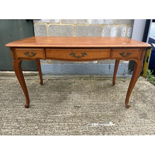 106 - A French three drawer writing desk