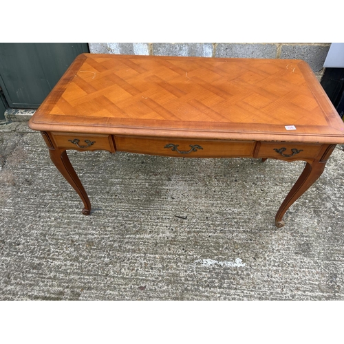 106 - A French three drawer writing desk