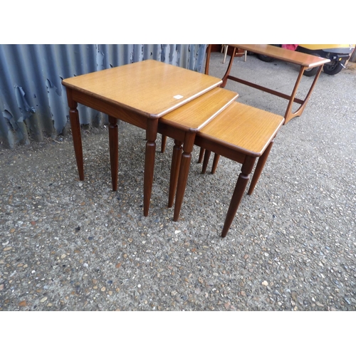 122 - A retro teak nest of three tables