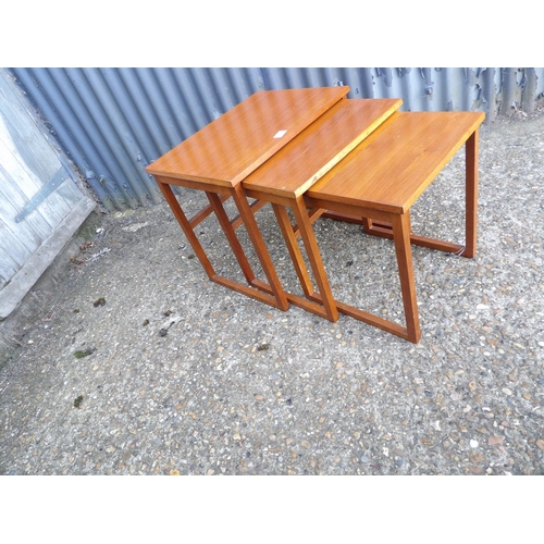 123 - A teak nest of three tables