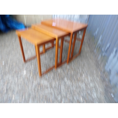 123 - A teak nest of three tables