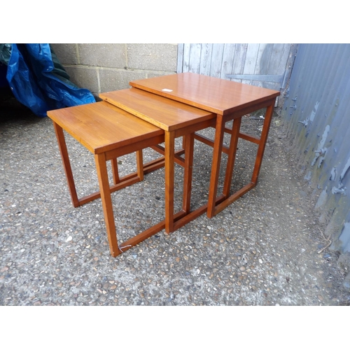 123 - A teak nest of three tables