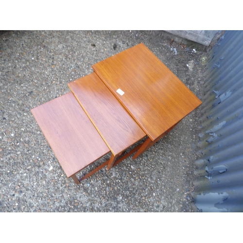 123 - A teak nest of three tables