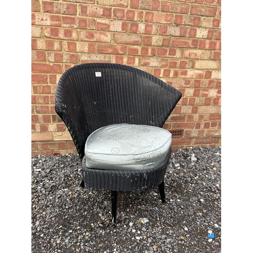 13 - A black Lloyd loom chair