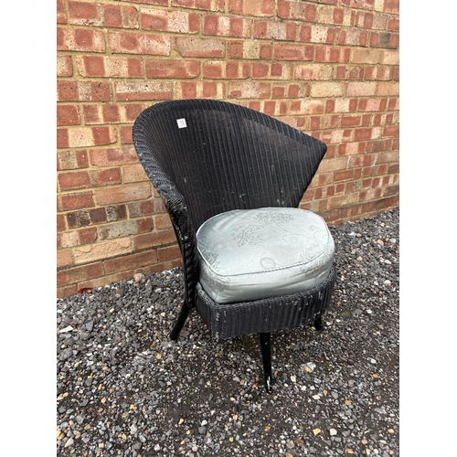 13 - A black Lloyd loom chair